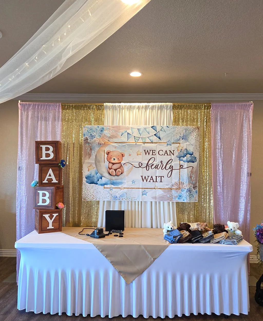 Baby shower welcome table with themed decor setup at Orangecrest Club