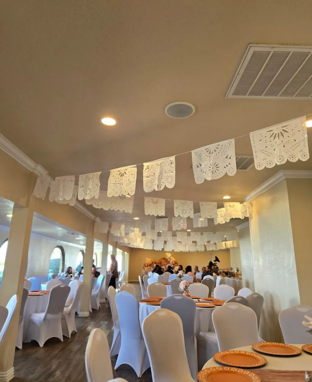 Rustic fiesta themed event setup with decorative banners at Orangecrest Club