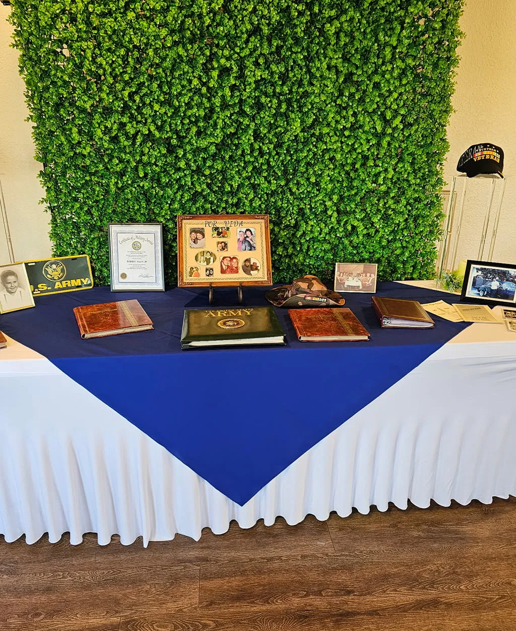 Military service tribute and memory display table at Orangecrest Club event