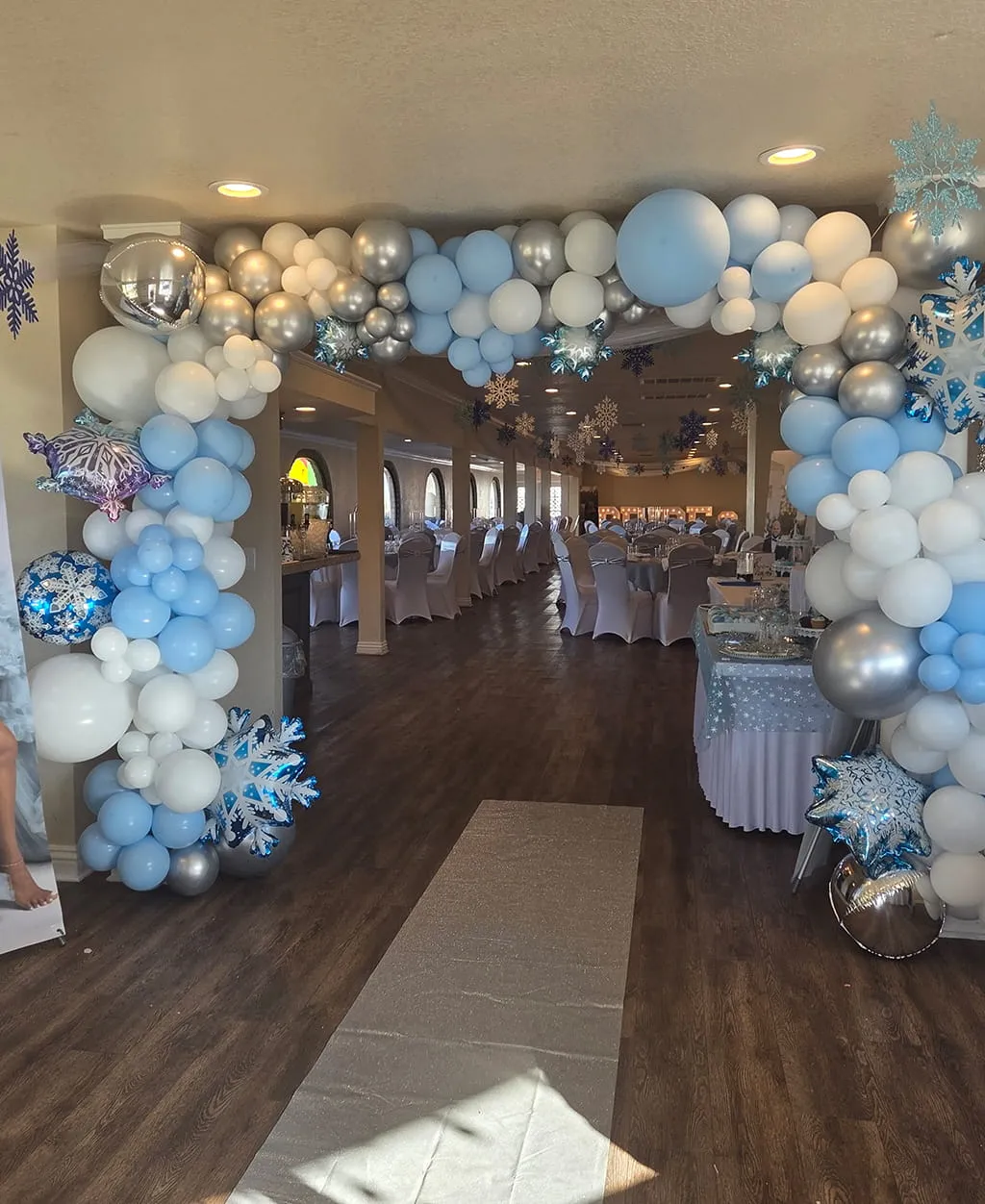 Elegant blue and white balloon arch entrance for baby shower at Orangecrest Club