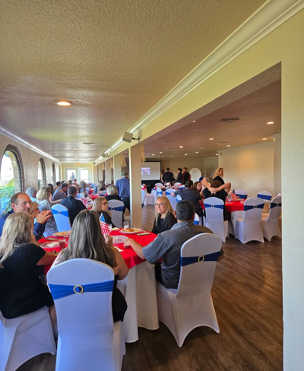 Professional catering staff serving food at Orangecrest Club event