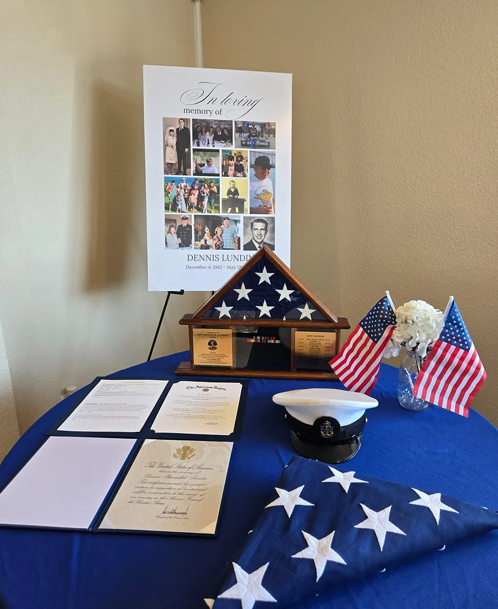 Military memorial tribute table with folded American flag and remembrance display at Orangecrest Club