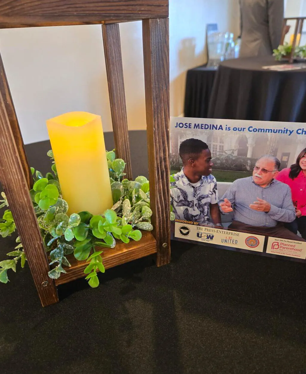 Decorative candle and event welcome table setup at Orangecrest Club