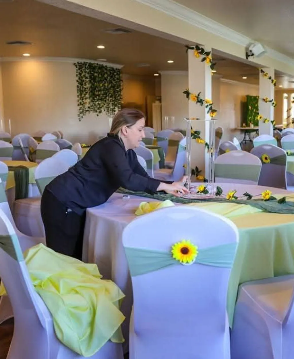 Sunflower themed table decorations and event setup at Orangecrest Club