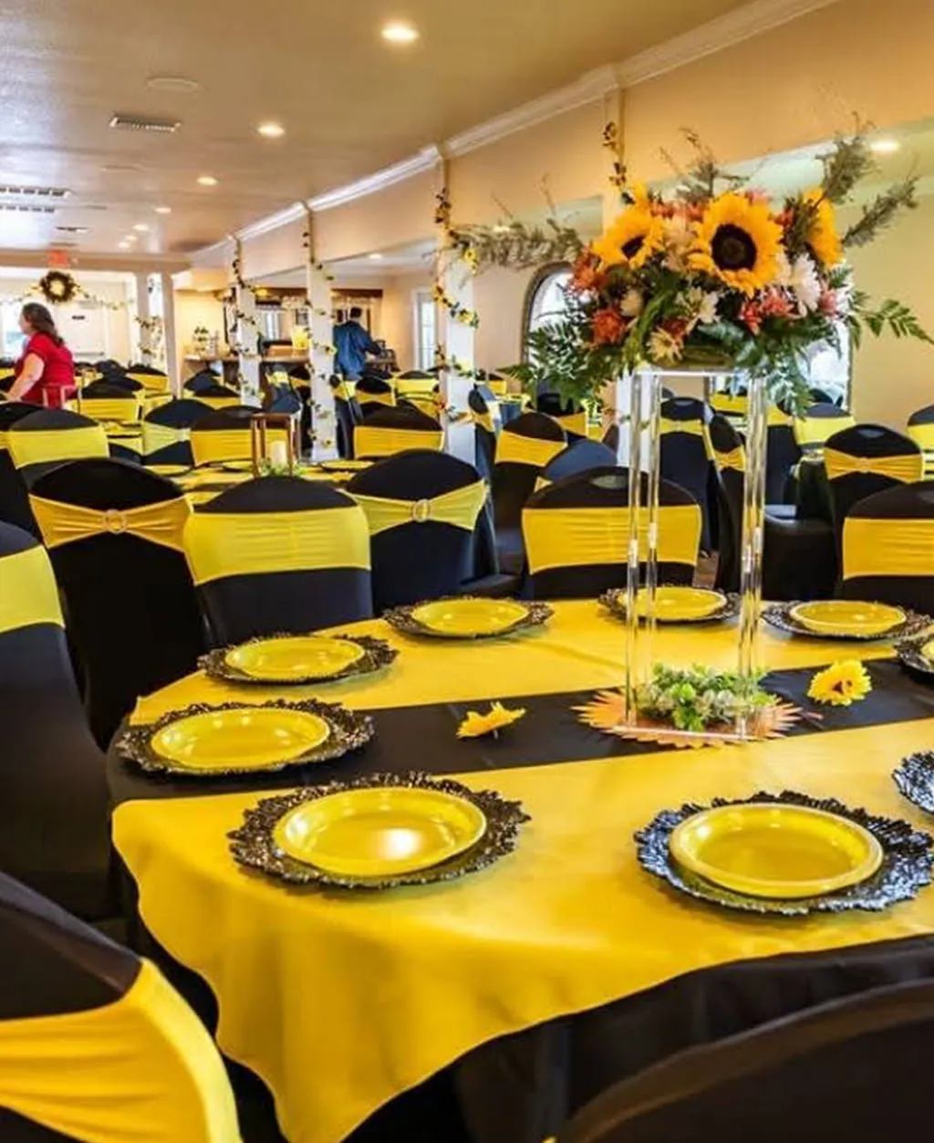 Yellow and black themed event table and reception setup at Orangecrest Club