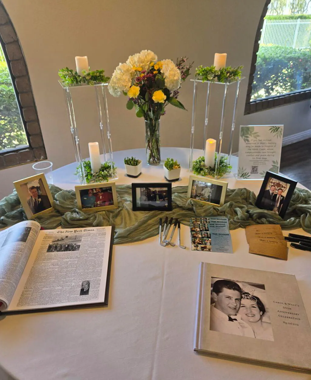 Anniversary or celebration memory table with photos and candles at Orangecrest Club
