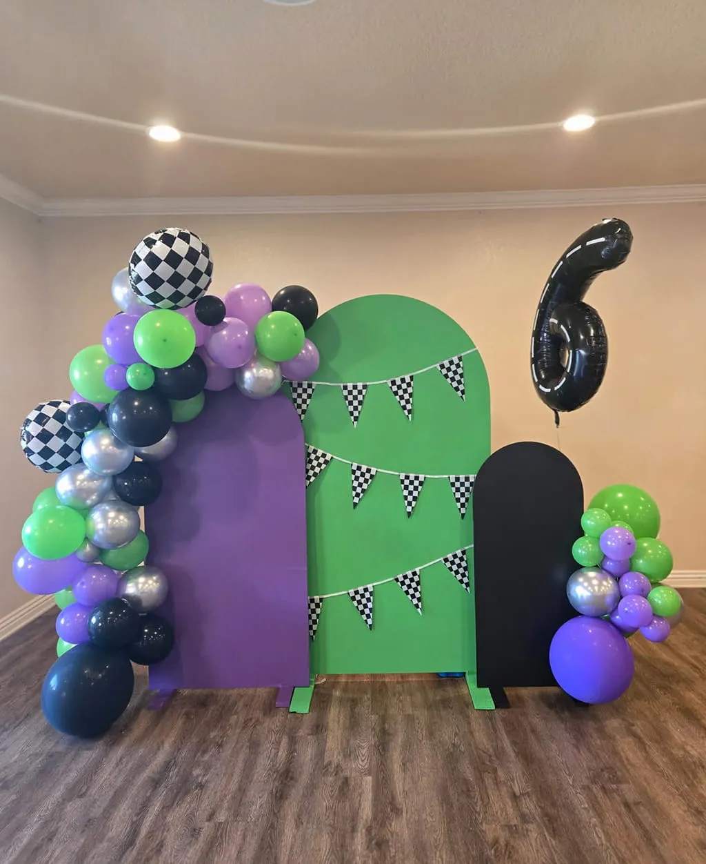 Kids race themed birthday backdrop and balloon decor at Orangecrest Club