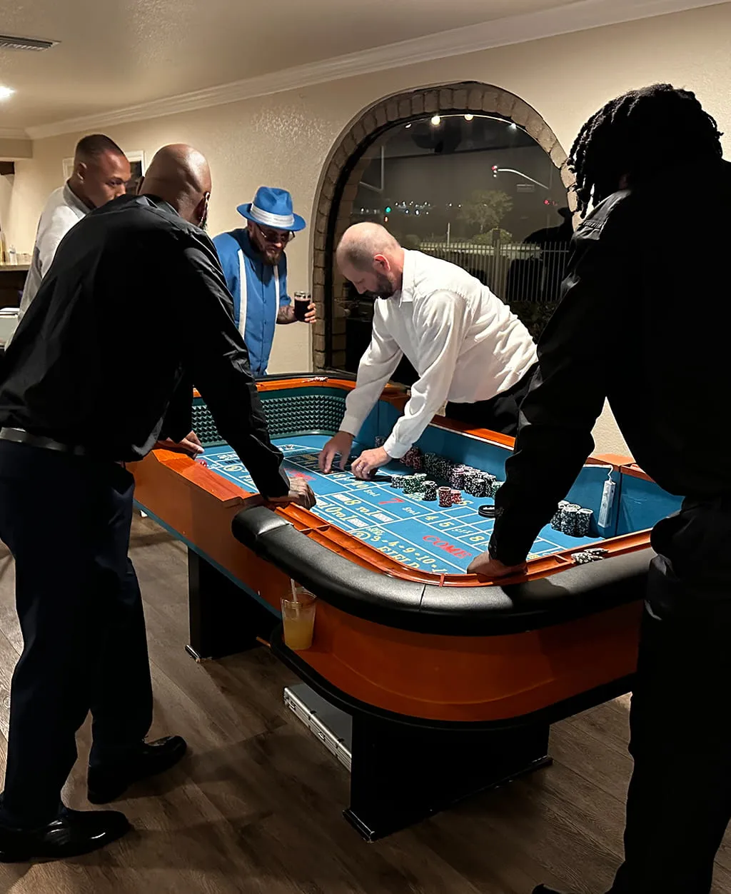 Casino themed party with gaming table setup at Orangecrest Club