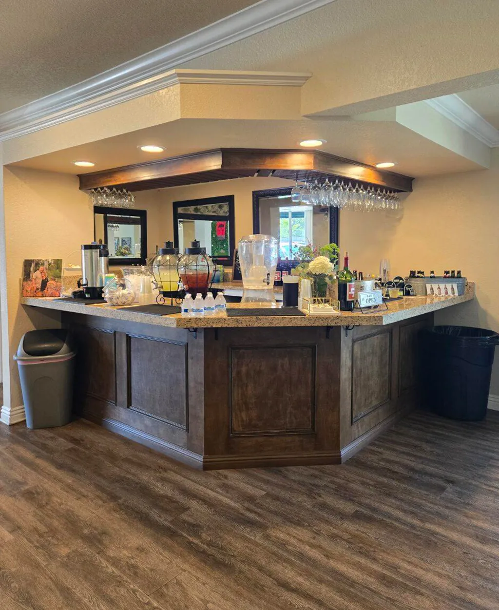 Event bar and refreshment station setup inside Orangecrest Club with beverage dispensers and serving counter