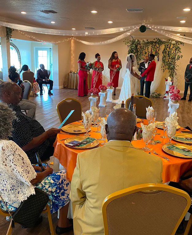 Indoor wedding ceremony setup with decorated altar and guests seated at Orangecrest Club private event venue