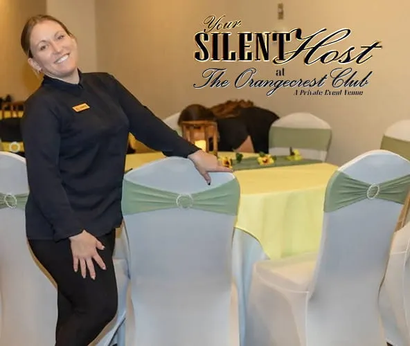 Event staff member preparing decorated tables with Your Silent Host service at Orangecrest Club private event venue