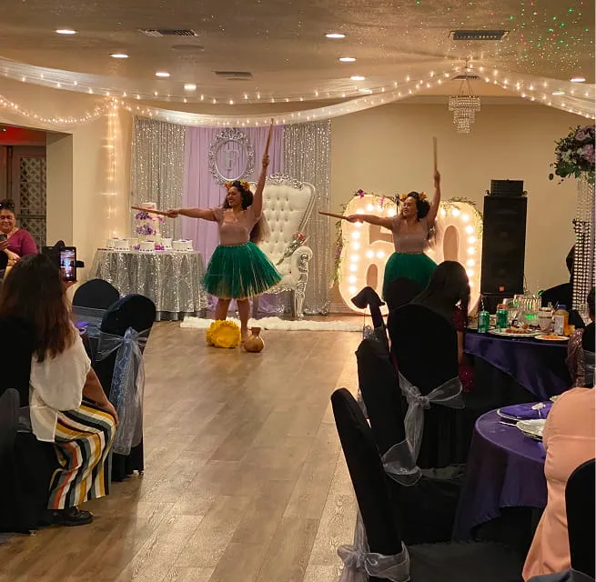 Live entertainment performance at wedding reception with elegant stage setup at Orangecrest Club